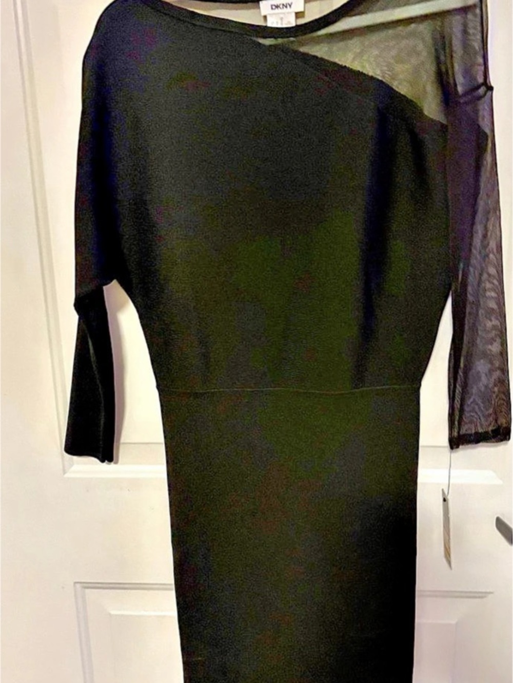 DKNY Asymmetrical Mesh Sleeve scuba material Black Mini Dress.
Never worn